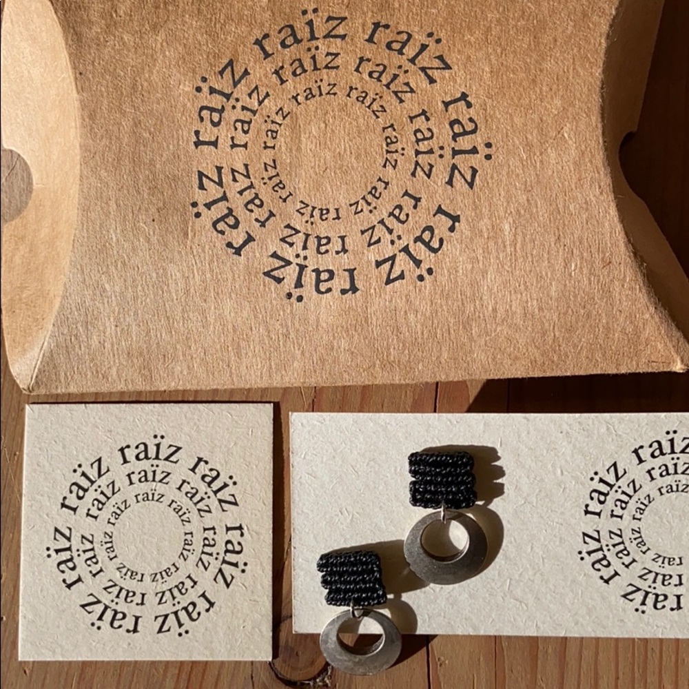 Macrame and silver adornment detail earrings.